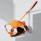 Dog harness and retractable leash designed for control and safety during city walks.