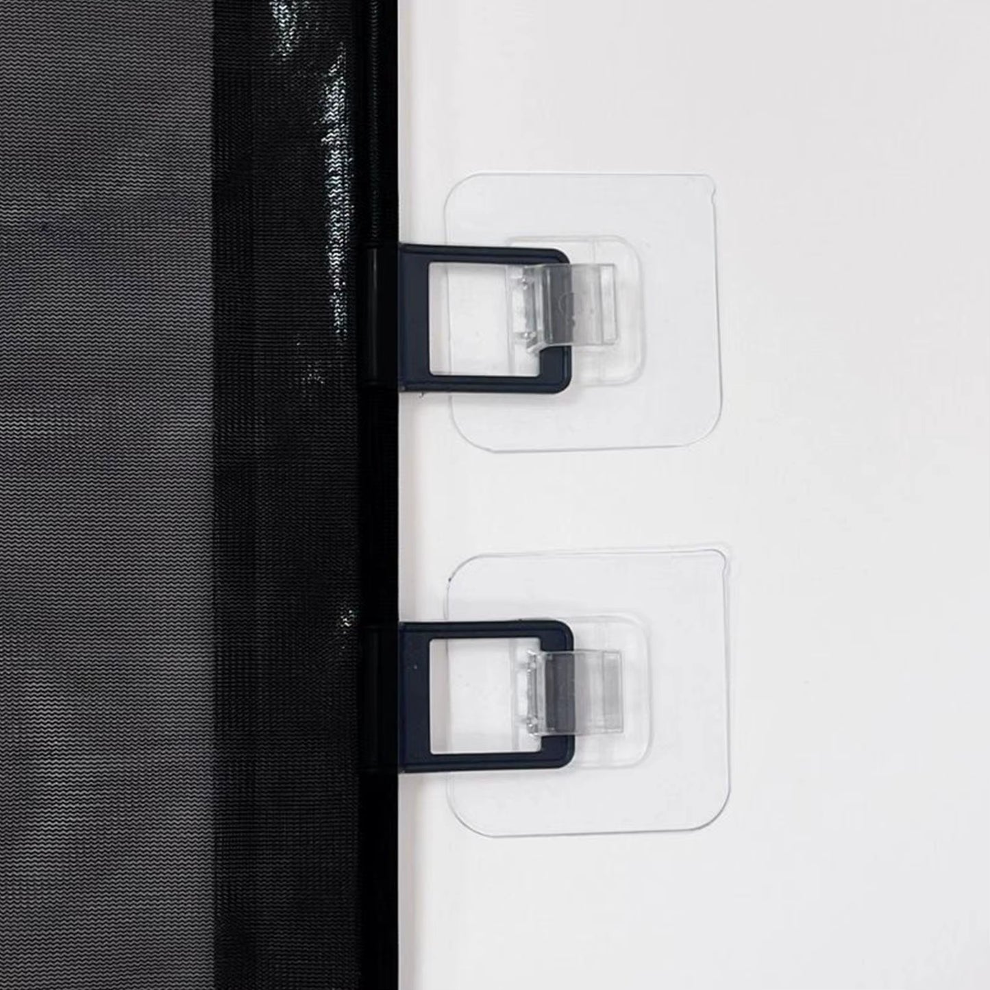 Retractable dog gate wall mounting detail showing adhesive no-drill installation brackets