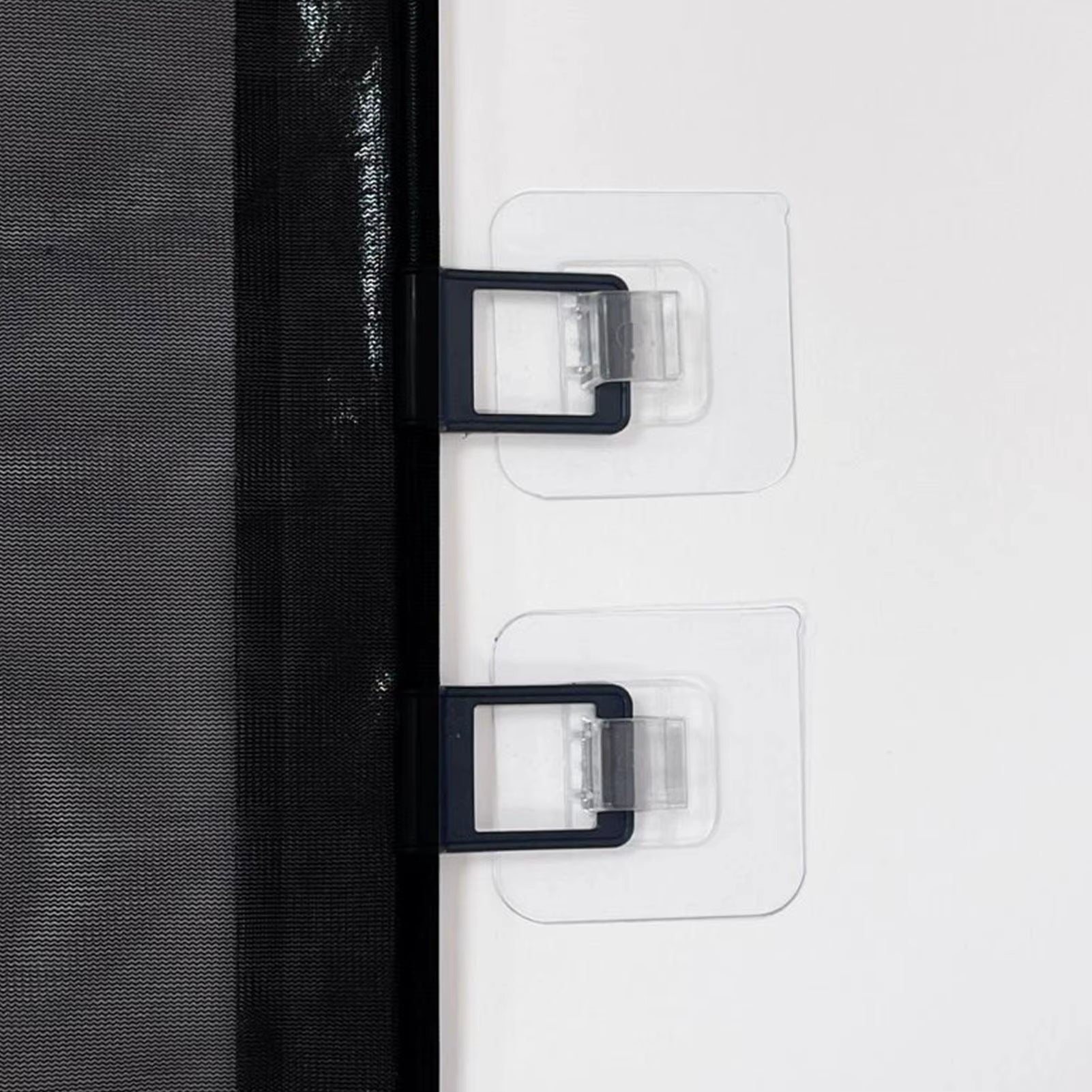 Retractable dog gate wall mounting detail showing adhesive no-drill installation brackets