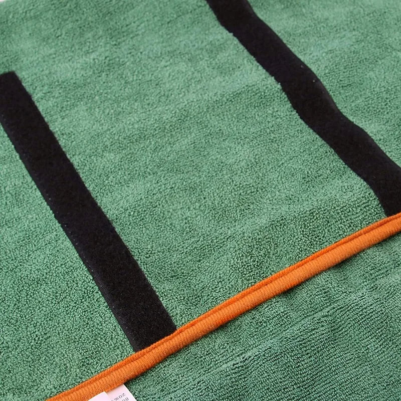 Close-up of super absorbent microfiber fabric on a dog bathrobe, showing soft texture and fast drying material