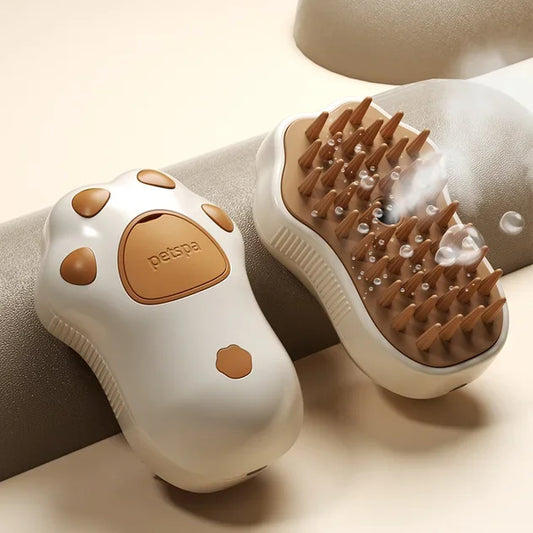 Electric cat steam brush designed for gentle grooming and massage with steam feature.