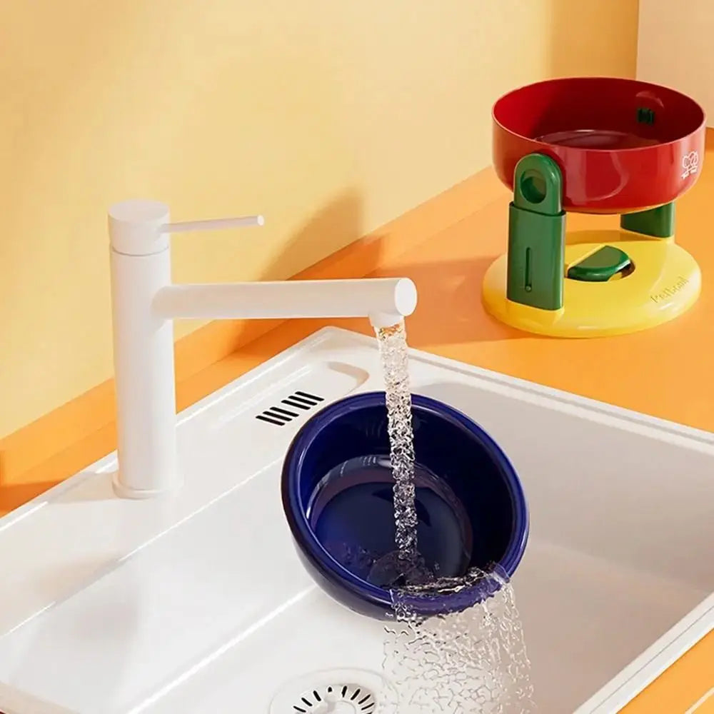 White faucet pouring water into a blue bowl