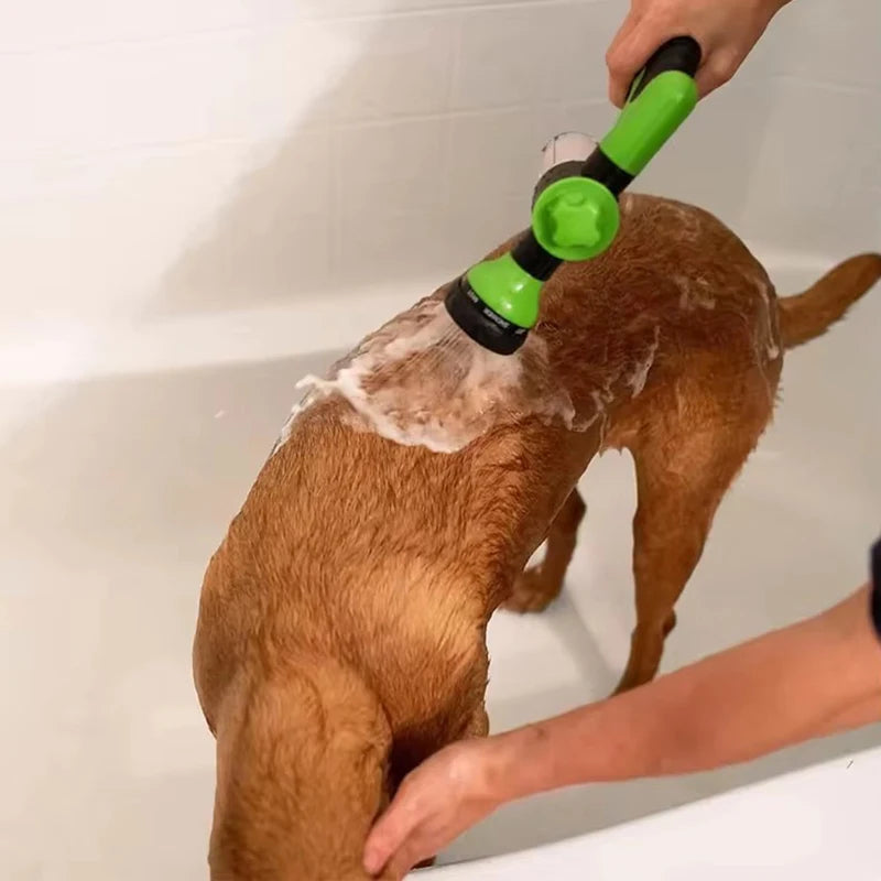 Dog being washed in a bathtub using the Robypet dog bathing kit with soap and controlled spray.