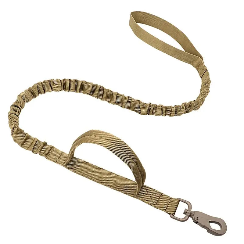 Khaki tactical dog leash with padded handle, elastic bungee section, and strong metal hook, shown laid out to highlight flexibility and construction